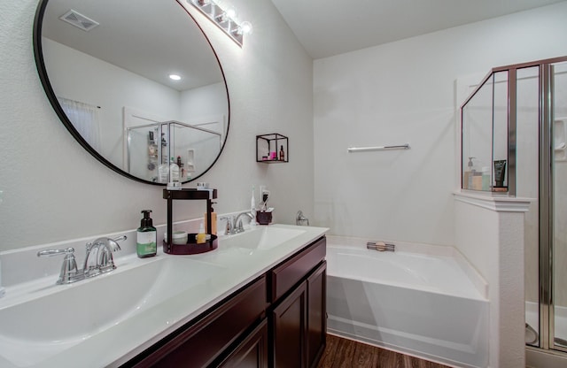 bathroom with vanity, wood-type flooring, and separate shower and tub