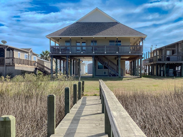 rear view of property with a yard