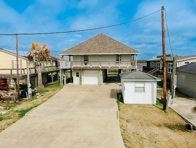 view of front of home featuring a storage shed and a garage