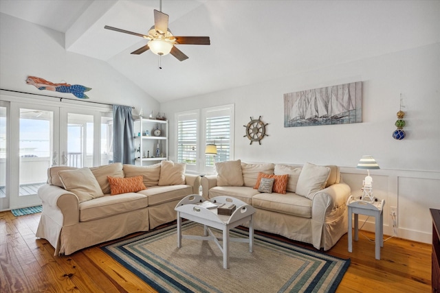 living room featuring french doors, ceiling fan, vaulted ceiling, and hardwood / wood-style flooring