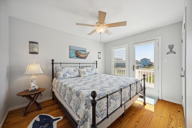 bedroom with ceiling fan, hardwood / wood-style floors, and access to outside