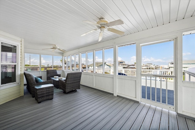 sunroom featuring ceiling fan