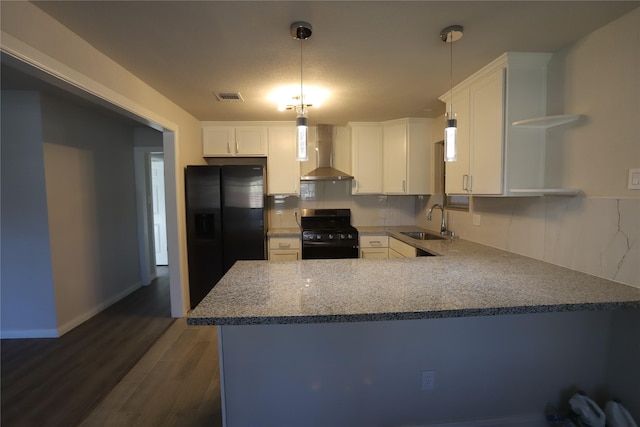 kitchen featuring white cabinetry, sink, wall chimney exhaust hood, and black appliances