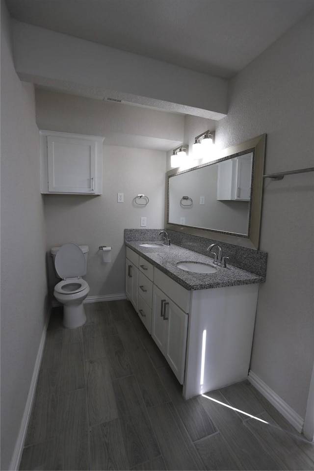 bathroom with vanity and toilet