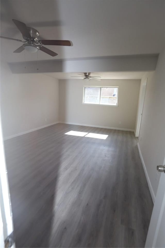 unfurnished room featuring dark hardwood / wood-style flooring