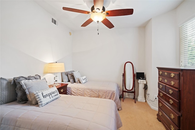 bedroom with light colored carpet and ceiling fan