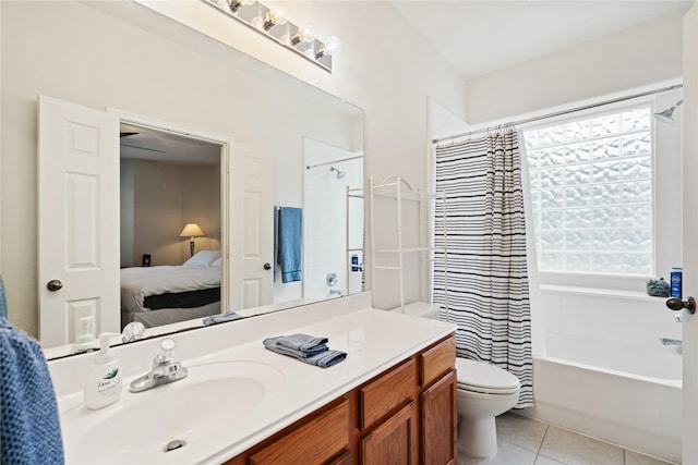 full bathroom featuring shower / bath combination with curtain, tile patterned floors, toilet, and vanity