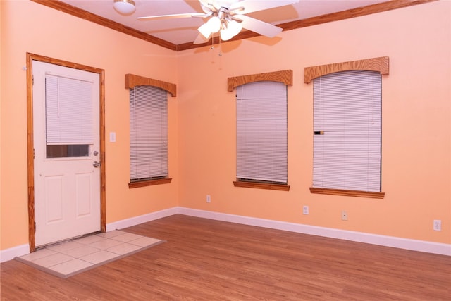 spare room with ornamental molding, hardwood / wood-style floors, and ceiling fan