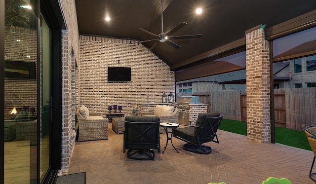 view of patio featuring an outdoor hangout area, grilling area, ceiling fan, and an outdoor kitchen