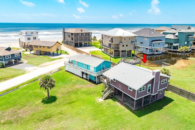 aerial view featuring a view of the beach and a water view