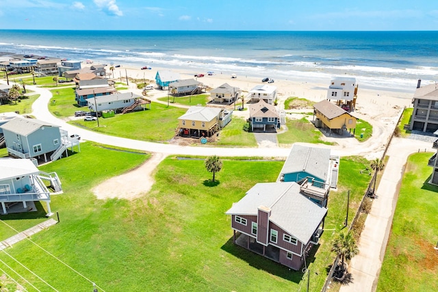 birds eye view of property featuring a view of the beach and a water view