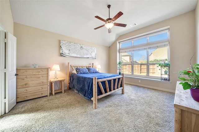 carpeted bedroom featuring ceiling fan and vaulted ceiling