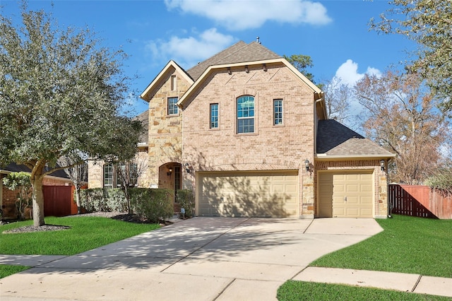 view of front of property with a garage and a front yard