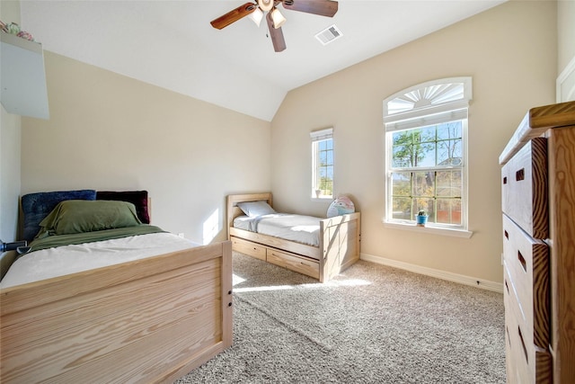 bedroom featuring lofted ceiling, carpet flooring, and ceiling fan