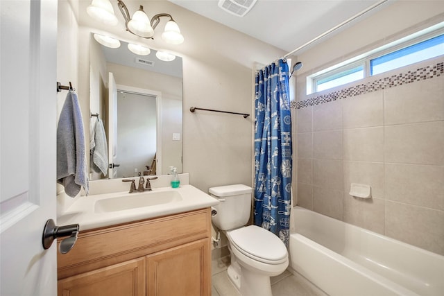 full bathroom featuring vanity, shower / bath combination with curtain, and toilet