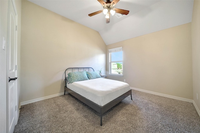 bedroom featuring ceiling fan, vaulted ceiling, and carpet