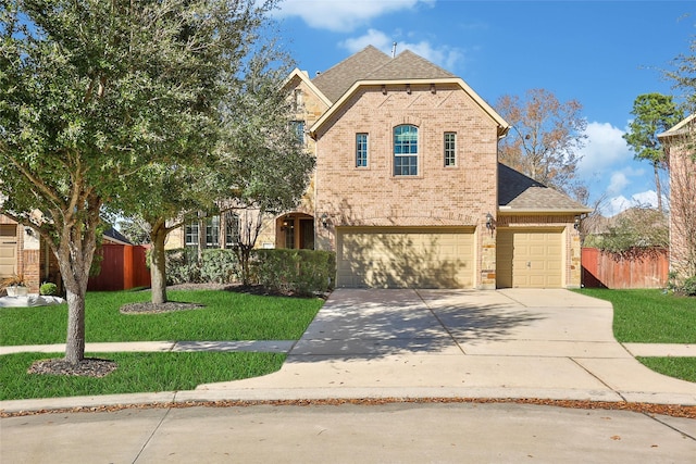 view of front of property with a garage and a front yard