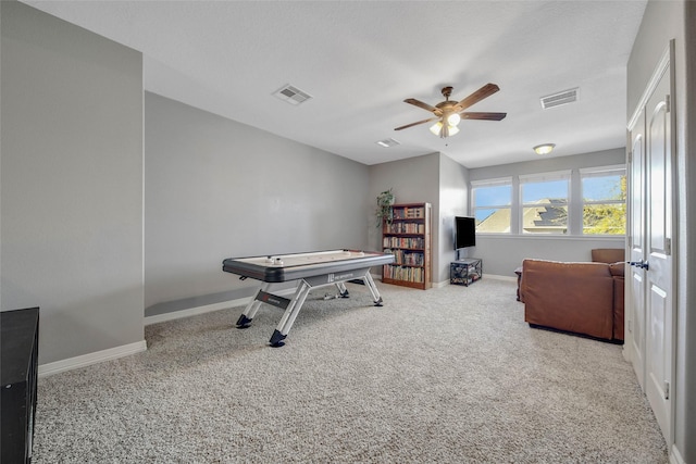 game room with ceiling fan and carpet