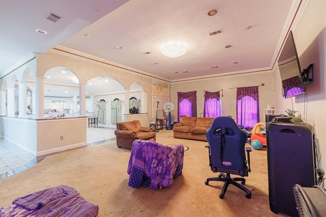 tiled living room with ornate columns and ornamental molding