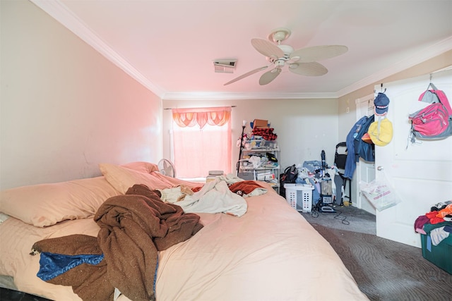 bedroom featuring ceiling fan, ornamental molding, and carpet floors