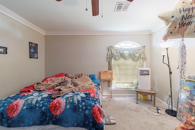 bedroom with crown molding, carpet flooring, and ceiling fan