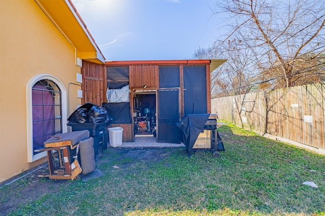 view of outdoor structure with a lawn