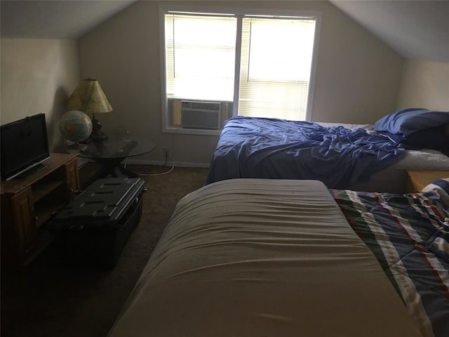 bedroom with cooling unit, vaulted ceiling, and dark colored carpet