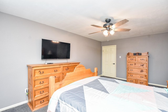 carpeted bedroom featuring ceiling fan and baseboards