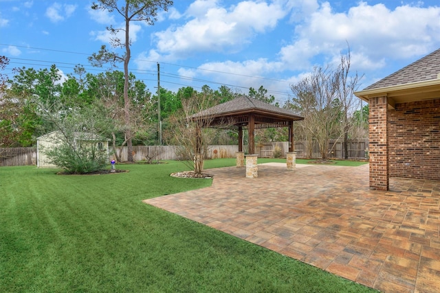 view of yard with a gazebo, an outdoor structure, and a patio