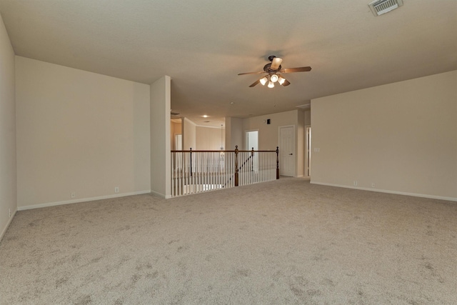 carpeted empty room with a textured ceiling and ceiling fan