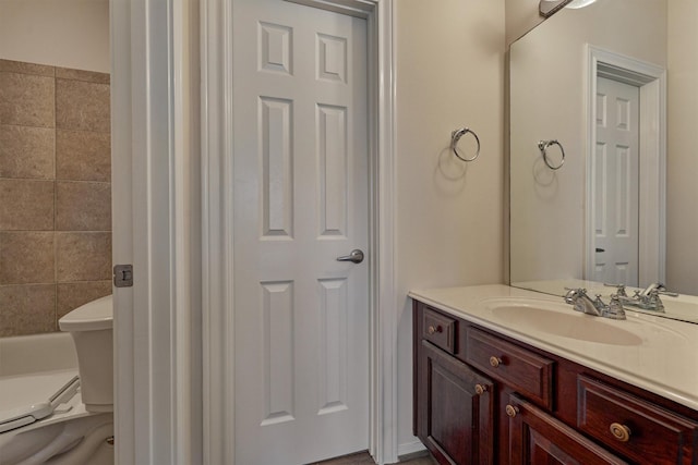 bathroom featuring vanity and toilet