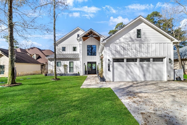 modern inspired farmhouse with a garage and a front lawn