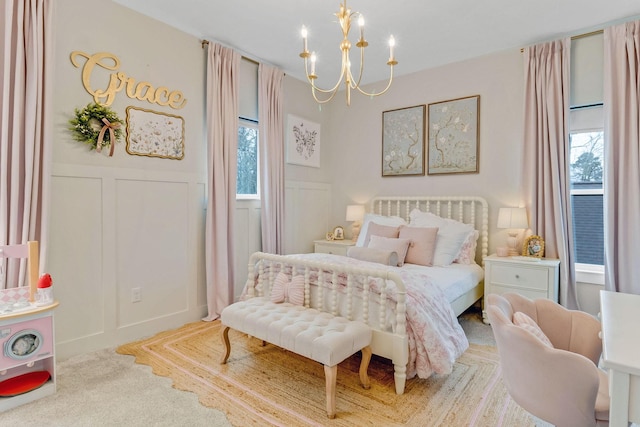 bedroom featuring an inviting chandelier and carpet floors