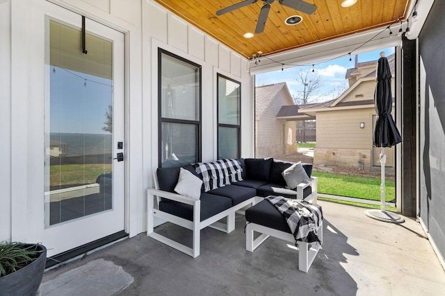 sunroom / solarium featuring wood ceiling and ceiling fan