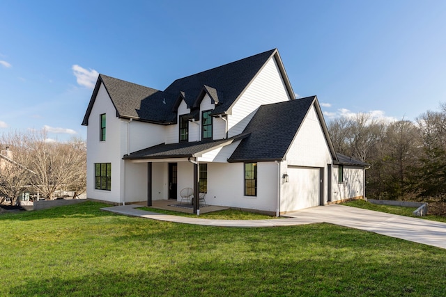 view of front facade with a garage and a front yard