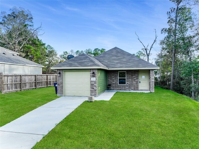 view of front of home featuring a garage and a front yard