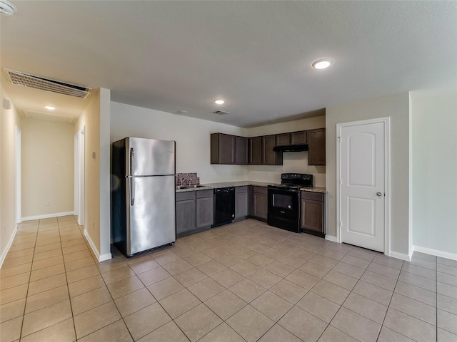 kitchen with dark brown cabinetry, black appliances, and light tile patterned flooring