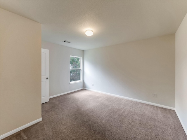 unfurnished room featuring carpet flooring