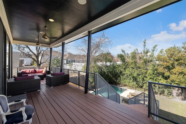 wooden deck featuring an outdoor hangout area and ceiling fan