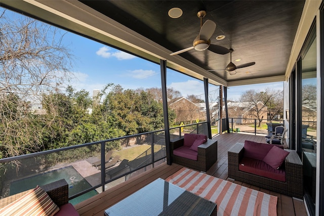 sunroom / solarium with ceiling fan