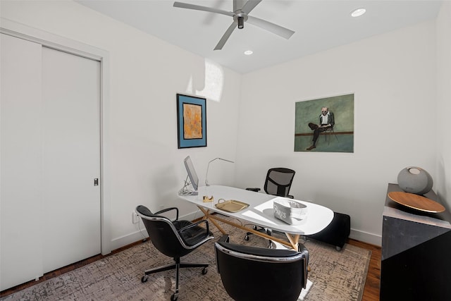 office space with hardwood / wood-style floors and ceiling fan