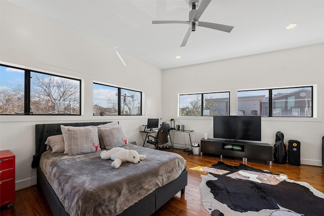 bedroom with dark wood-type flooring and ceiling fan