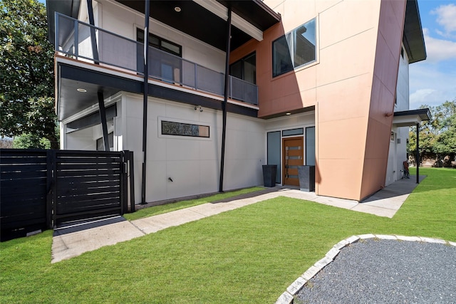 doorway to property featuring a yard