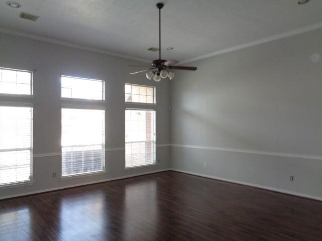 unfurnished room featuring crown molding, dark wood-type flooring, and ceiling fan