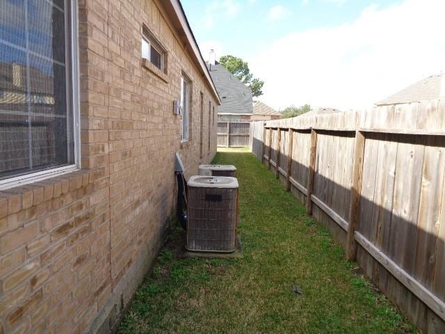 view of yard with central AC