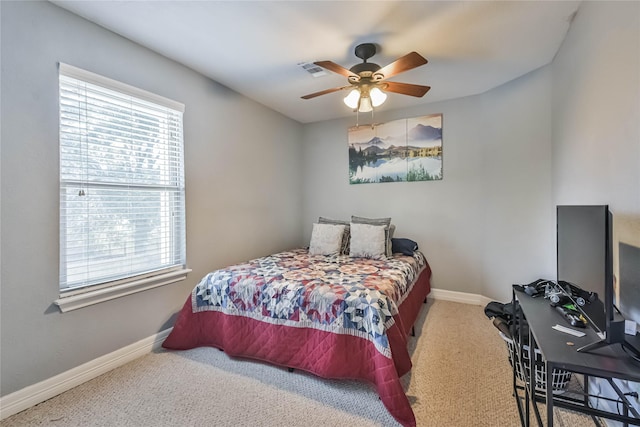 carpeted bedroom featuring ceiling fan