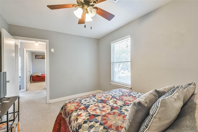 bedroom with light colored carpet and ceiling fan