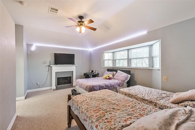 carpeted bedroom featuring ceiling fan and lofted ceiling