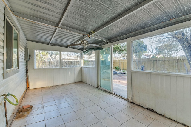 unfurnished sunroom featuring ceiling fan