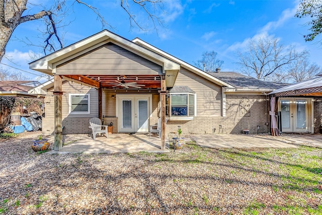 rear view of property with french doors, ceiling fan, a patio, and a gazebo